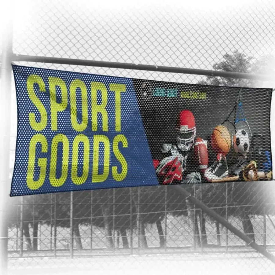 Mesh banner for a sporting goods store mounted on a chain-link fence